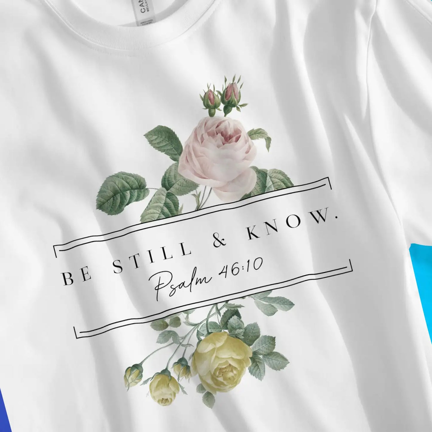 Be Still & Know (Floral) | Premium Unisex Christian T-Shirt, laid flat, designed by 3rd Day Christian Clothing UK