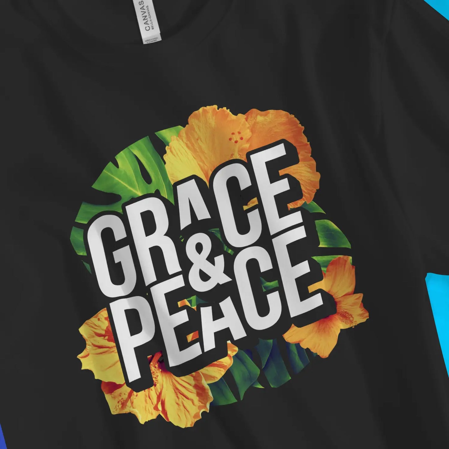 Grace & Peace (Tropical) | Premium Unisex Christian T-Shirt, laid flat, designed by 3rd Day Christian Clothing UK