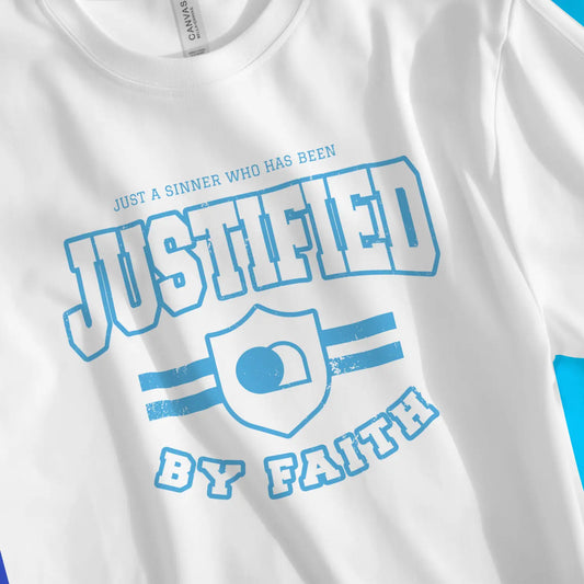 JUSTIFIED (Emblem) | Premium Unisex Christian T-Shirt, laid flat, designed by 3rd Day Christian Clothing UK