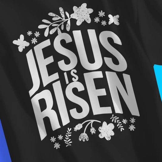 Jesus Is Risen (Floral) 2.0 | Premium Unisex Christian T-Shirt, laid flat, designed by 3rd Day Christian Clothing UK