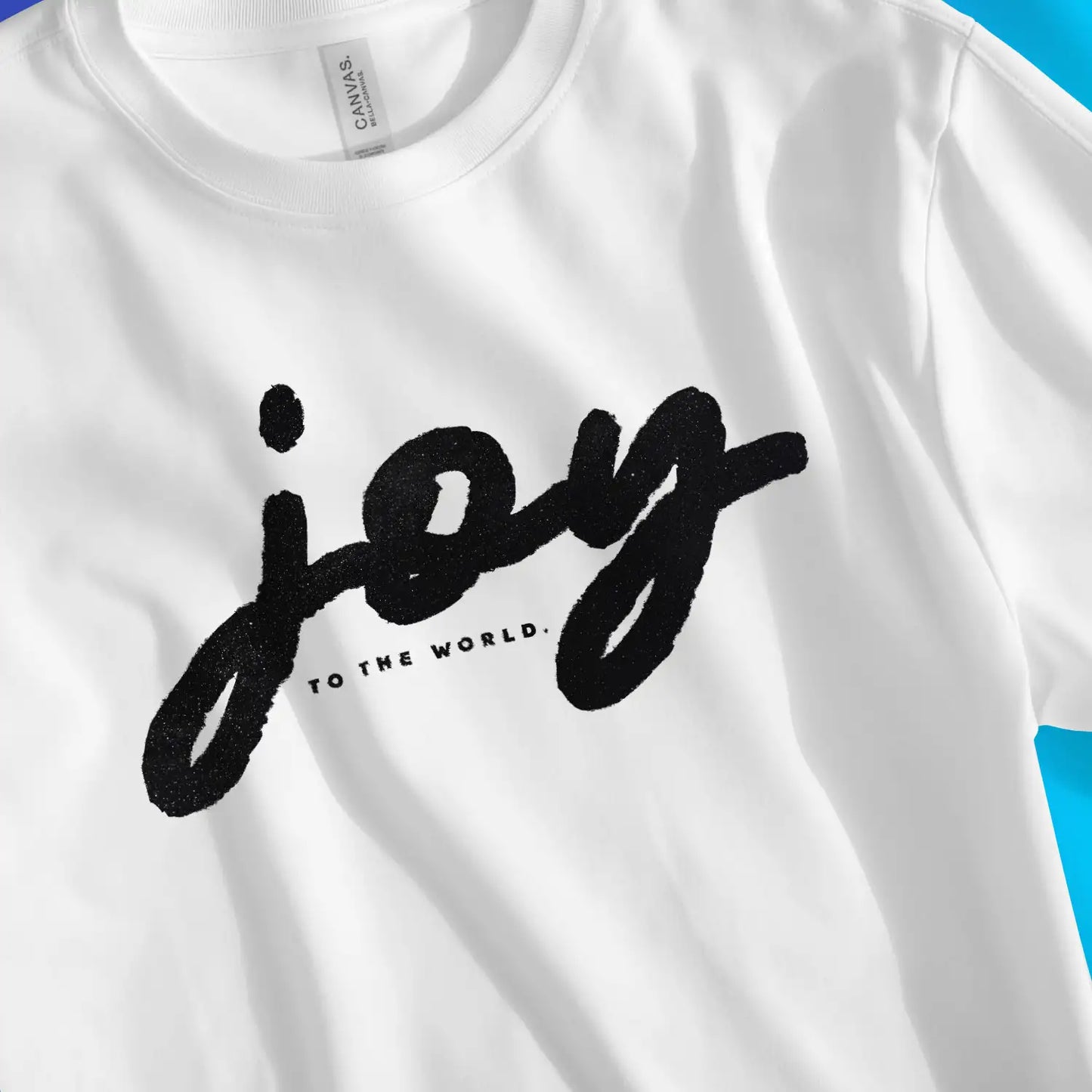 Joy To The World (Ink) | Premium Unisex Christian T-Shirt, laid flat, designed by 3rd Day Christian Clothing UK