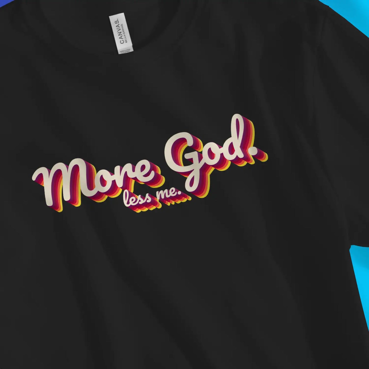 More God. less me. | Premium Unisex Christian T-Shirt, laid flat, designed by 3rd Day Christian Clothing UK