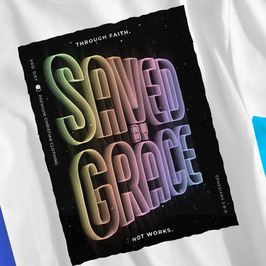 Saved By Grace (Neon Echo) | Premium Unisex Christian T-Shirt, laid flat, designed by 3rd Day Christian Clothing UK