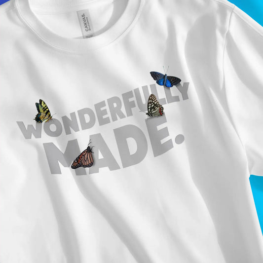 Wonderfully Made. (Butterflies) | Premium Unisex Christian T-Shirt, laid flat, designed by 3rd Day Christian Clothing UK