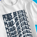 Peace, Be Still. (Wavy, White) – Unisex Christian T-Shirt